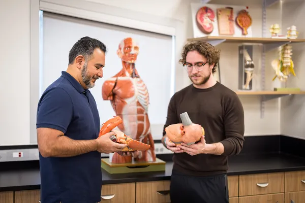 Student and professor in classroom